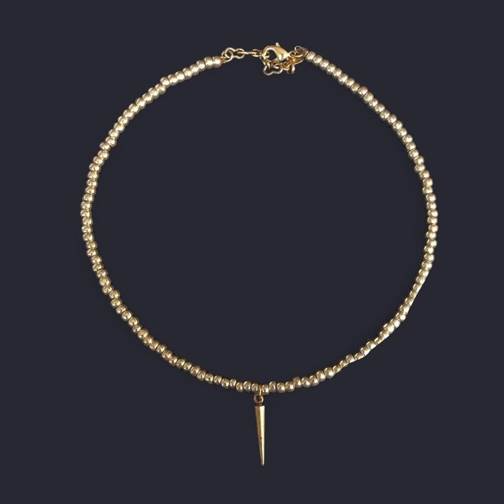 Gold Beaded Necklace with Dagger Pendant